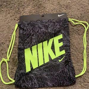 Selling Nike backpack, Size MISC Color Black and Lime Green